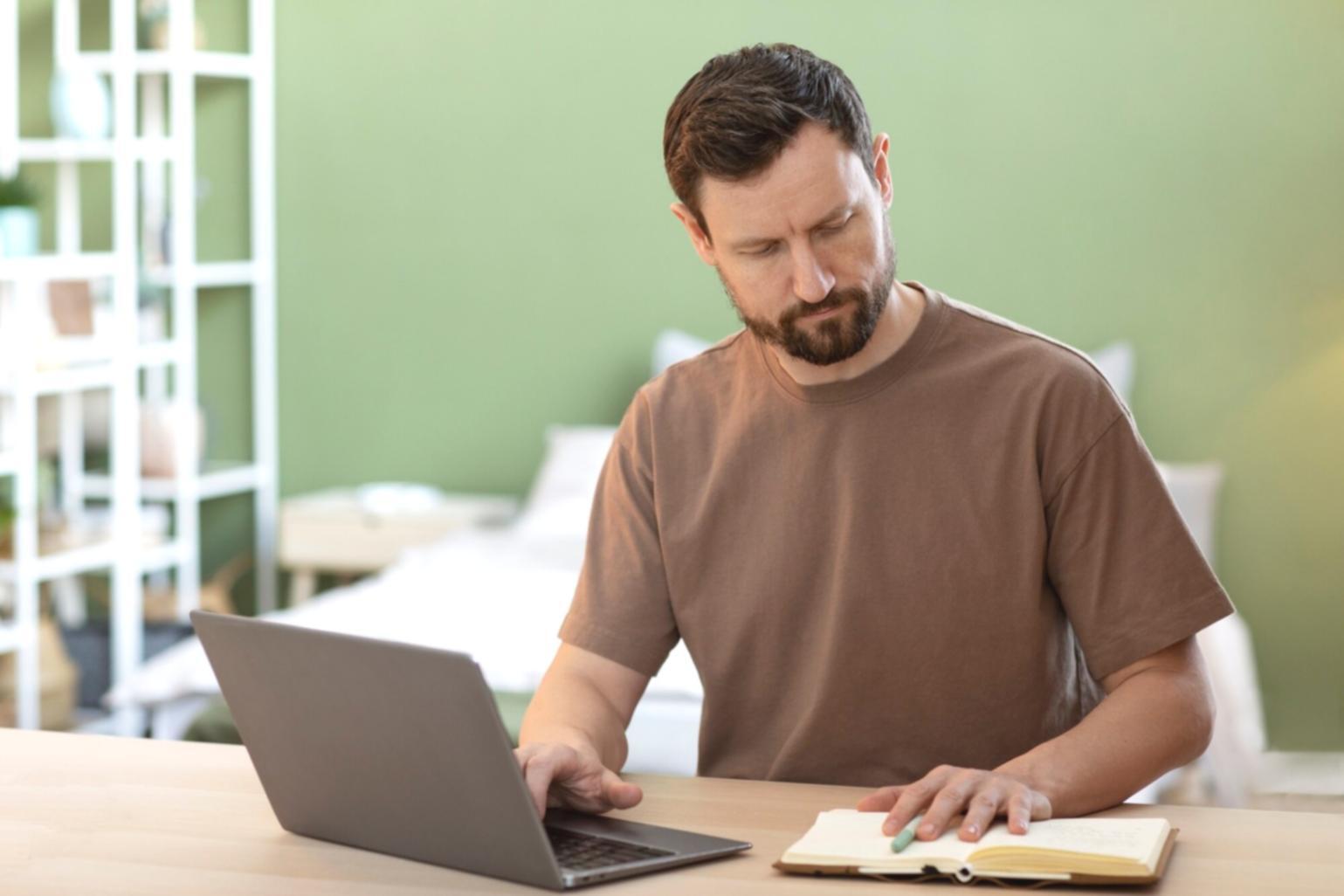 Family reviewing monthly expenses together at kitchen table